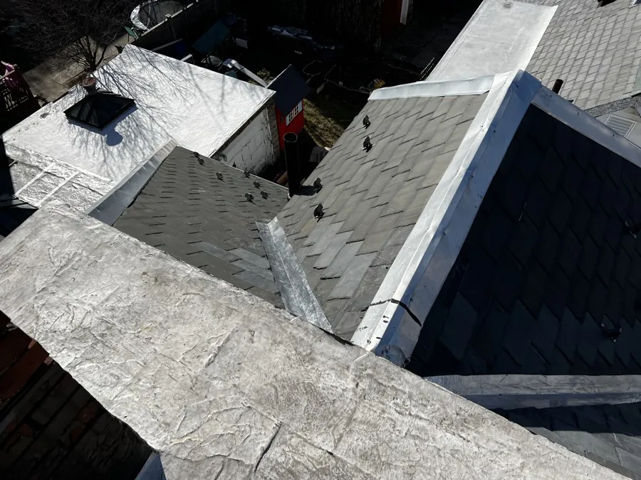 Close-up of new slate shingles and metal flashing